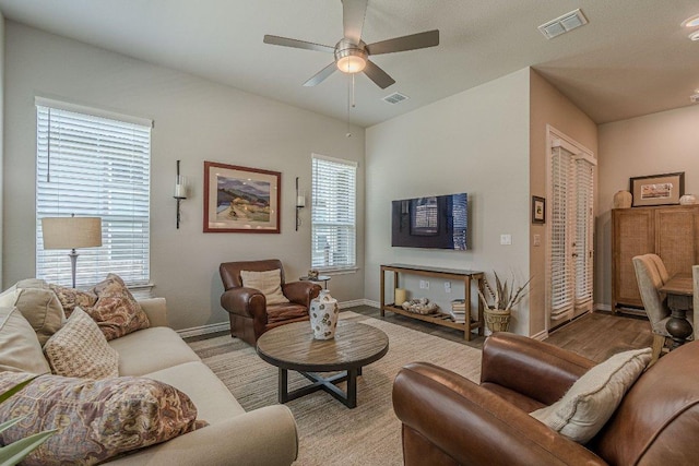 138 Harborside Dr Unit 101, San Marcos, TX 78666 - living area featuring a ceiling fan and baseboards