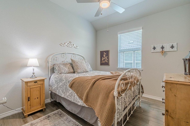 bedroom with baseboards, lofted ceiling, dark wood finished floors, and ceiling fan
