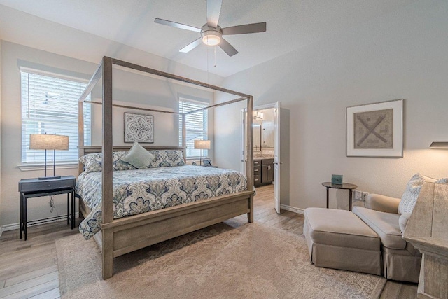 bedroom featuring light wood finished floors, multiple windows, and baseboards