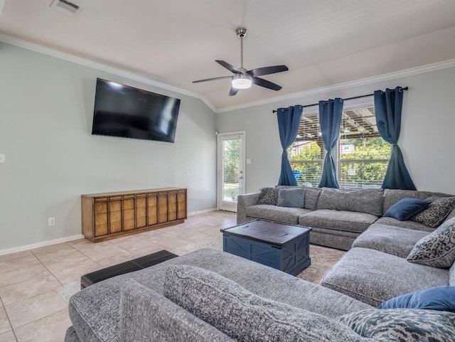 living area featuring crown molding, baseboards, a ceiling fan, vaulted ceiling, and tile patterned flooring