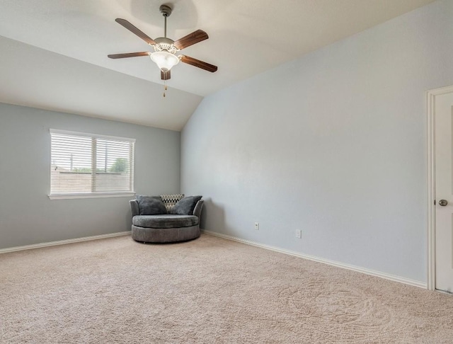 unfurnished room featuring carpet, ceiling fan, lofted ceiling, and baseboards