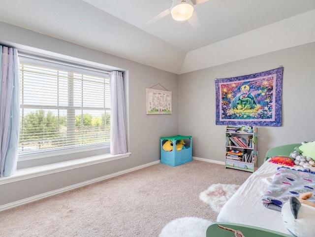 bedroom with carpet floors, baseboards, a ceiling fan, and vaulted ceiling