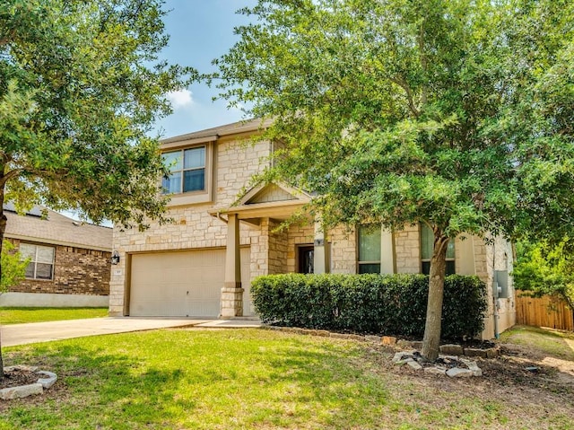 319 Sandstone Trl, Buda, TX 78610 - view of property hidden behind natural elements with stone siding, a garage, and driveway