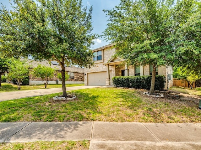 319 Sandstone Trl, Buda, TX 78610 - obstructed view of property featuring stone siding, driveway, and a garage