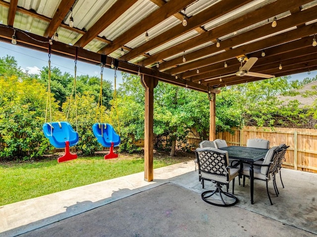 319 Sandstone Trl, Buda, TX 78610 - fenced backyard featuring outdoor dining space, a patio, and a ceiling fan