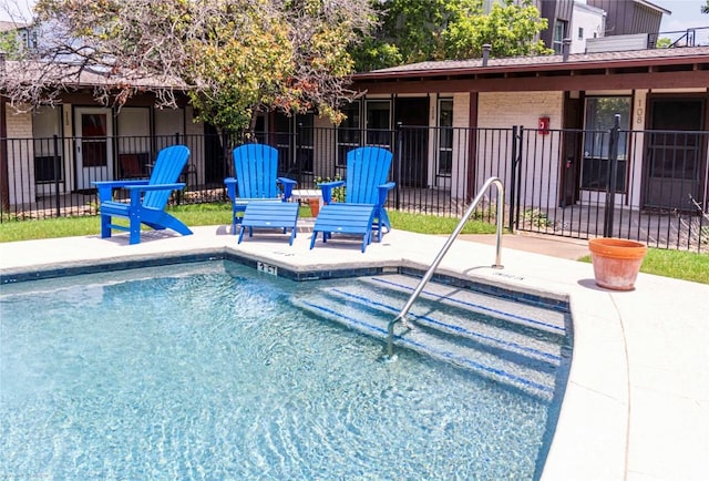 5601 Woodrow Ave Unit 109, Austin, TX 78756 - view of swimming pool with fence and a patio area