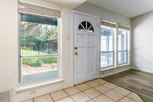 5601 Woodrow Ave Unit 109, Austin, TX 78756 - foyer featuring light tile patterned floors and baseboards