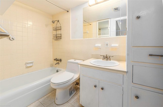 5601 Woodrow Ave Unit 109, Austin, TX 78756 - full bathroom featuring tile walls, toilet, tile patterned flooring, shower / washtub combination, and tasteful backsplash