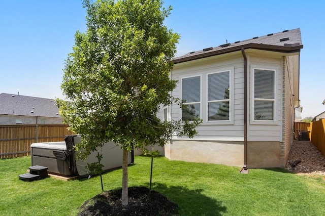 303 Kings Pine Dr, Dripping Springs, TX 78620 - rear view of house featuring a hot tub and central air condition unit