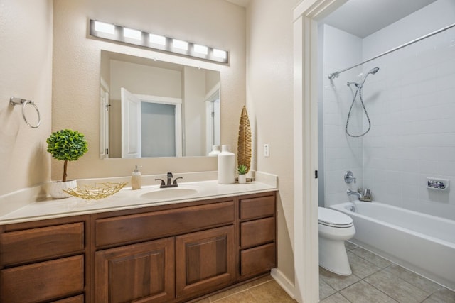 full bathroom with tile patterned floors, toilet, vanity, and shower / tub combination