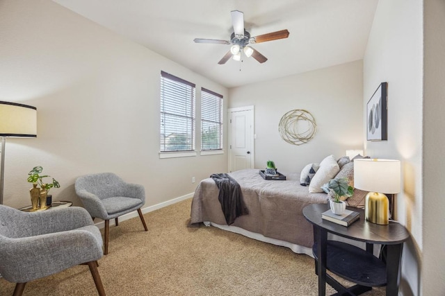 bedroom with light carpet, baseboards, and a ceiling fan