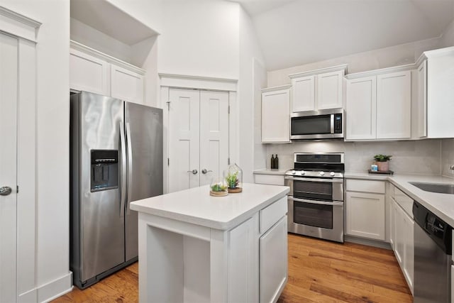 11009 Avery Station Loop Unit 32, Austin, TX 78717 - kitchen featuring stainless steel appliances, white cabinetry, and backsplash