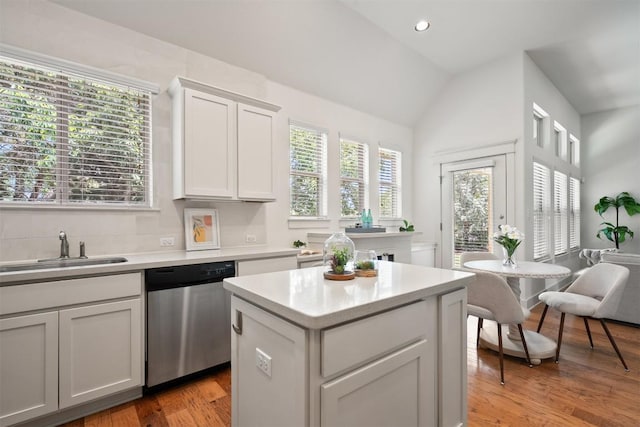 11009 Avery Station Loop Unit 32, Austin, TX 78717 - kitchen with dishwasher, vaulted ceiling, healthy amount of natural light, light countertops, and recessed lighting