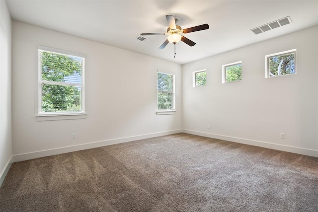 11009 Avery Station Loop Unit 32, Austin, TX 78717 - unfurnished room with ceiling fan, baseboards, and carpet