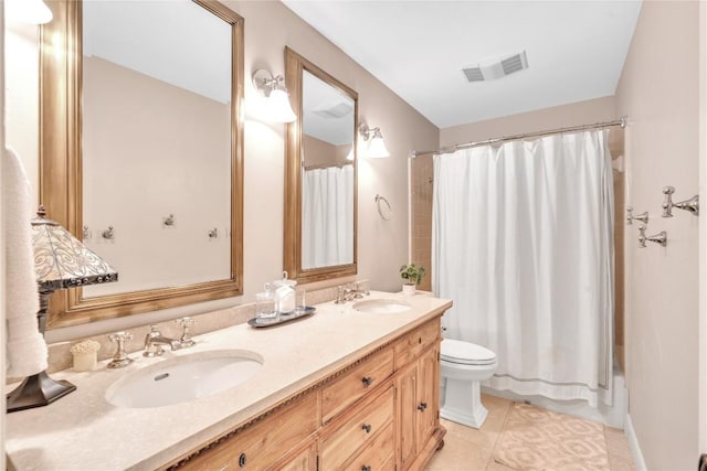 full bath featuring toilet, double vanity, tile patterned flooring, and shower / tub combo