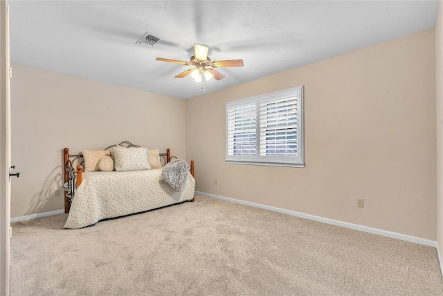carpeted bedroom featuring baseboards and ceiling fan