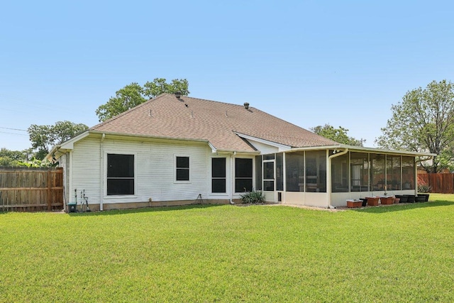 602 Leisurewoods Dr, Buda, TX 78610 - back of property with a sunroom and a shingled roof