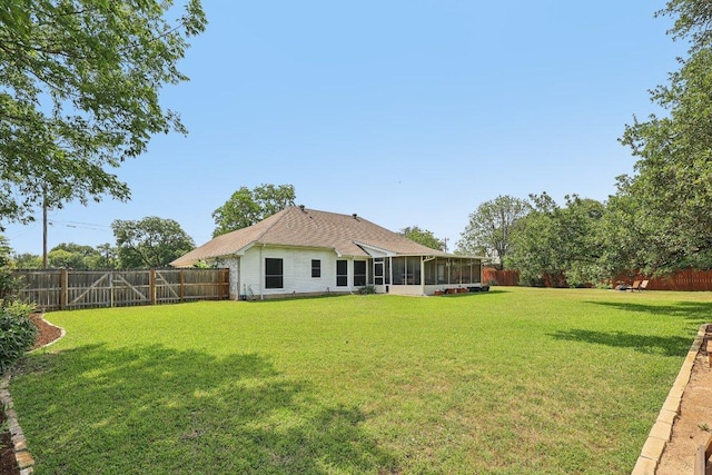 602 Leisurewoods Dr, Buda, TX 78610 - rear view of property featuring a sunroom
