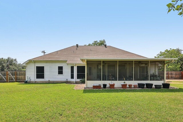 602 Leisurewoods Dr, Buda, TX 78610 - back of property with a sunroom and roof with shingles