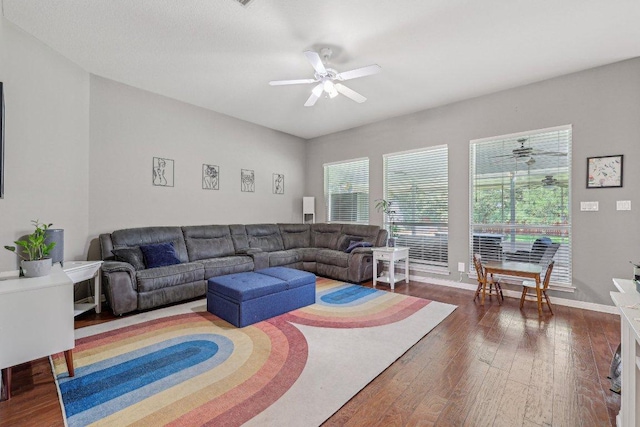 602 Leisurewoods Dr, Buda, TX 78610 - living area with ceiling fan, wood-type flooring, and baseboards