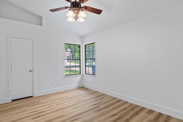 12309 Little Fatima Ln, Austin, TX 78753 - unfurnished room featuring lofted ceiling, light wood finished floors, baseboards, a ceiling fan, and a textured ceiling