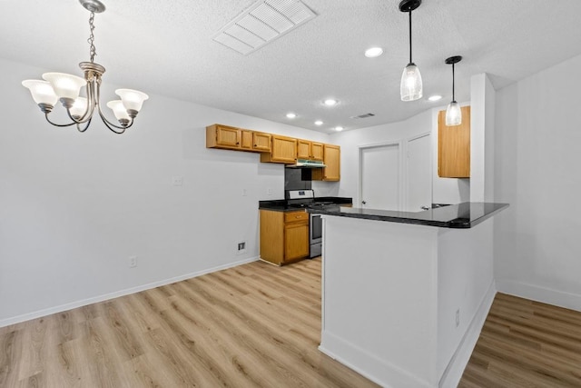 12309 Little Fatima Ln, Austin, TX 78753 - kitchen featuring stainless steel gas stove, recessed lighting, a textured ceiling, dark countertops, and light wood finished floors