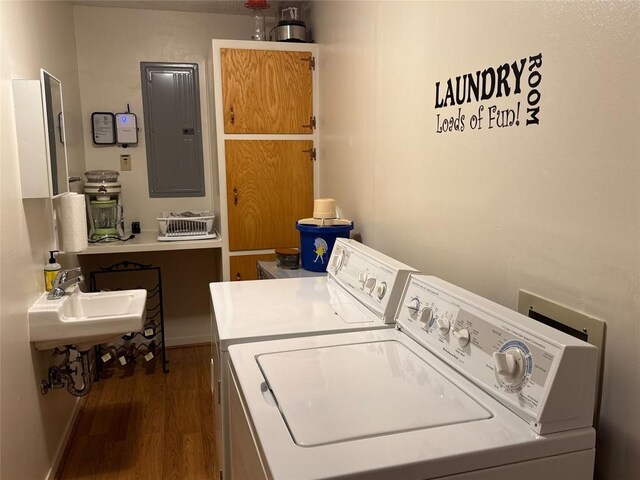 304 E Pheasant Rd, Highland Haven, TX 78654 - clothes washing area with washer and dryer, electric panel, and dark wood-style flooring