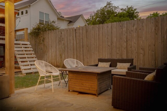 5607 Roosevelt Ave, Austin, TX 78756 - patio terrace at dusk with a patio area, stairs, and an outdoor living space