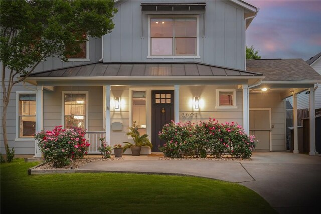 5607 Roosevelt Ave, Austin, TX 78756 - view of front of property with a standing seam roof, a porch, a metal roof, and a shingled roof