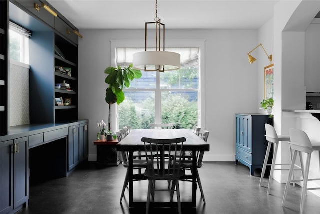 dining area with healthy amount of natural light and finished concrete flooring