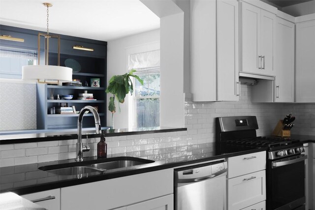 5607 Roosevelt Ave, Austin, TX 78756 - kitchen with stainless steel appliances, dark countertops, and tasteful backsplash