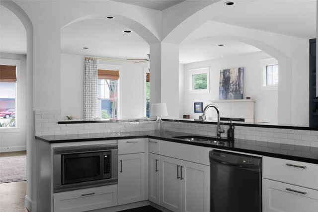 5607 Roosevelt Ave, Austin, TX 78756 - kitchen featuring dishwasher, built in microwave, ceiling fan, tasteful backsplash, and recessed lighting