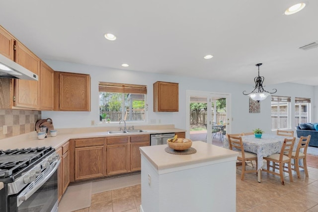 16914 Dorman Dr, Round Rock, TX 78681 - kitchen with plenty of natural light, stainless steel appliances, light tile patterned floors, light countertops, and recessed lighting