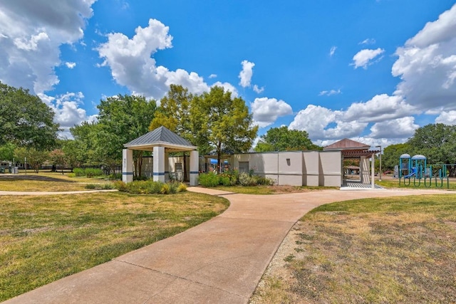 view of property's community with a gazebo and a lawn