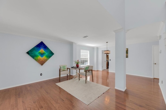 16914 Dorman Dr, Round Rock, TX 78681 - sitting room with wood finished floors and ornamental molding
