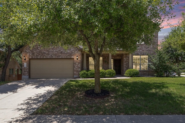 8317 Turning Trl, Austin, TX 78737 - obstructed view of property with brick siding, a front yard, an attached garage, and concrete driveway