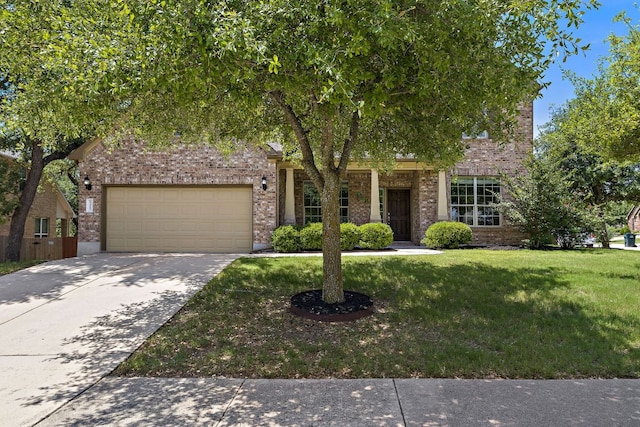 8317 Turning Trl, Austin, TX 78737 - obstructed view of property featuring brick siding, a front yard, an attached garage, and concrete driveway