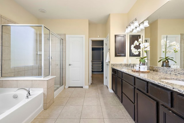 8317 Turning Trl, Austin, TX 78737 - bathroom with a stall shower, a garden tub, tile patterned flooring, and double vanity