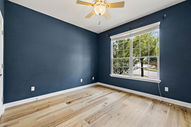 8317 Turning Trl, Austin, TX 78737 - unfurnished room with wood finished floors, baseboards, and ceiling fan