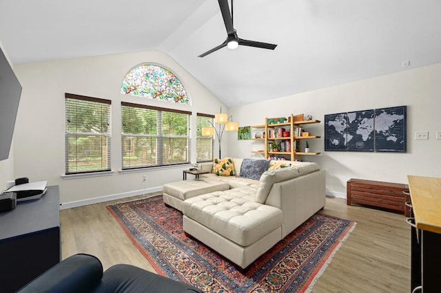 605 Galway Bay Cv, Pflugerville, TX 78660 - living room featuring ceiling fan, lofted ceiling, wood finished floors, and baseboards