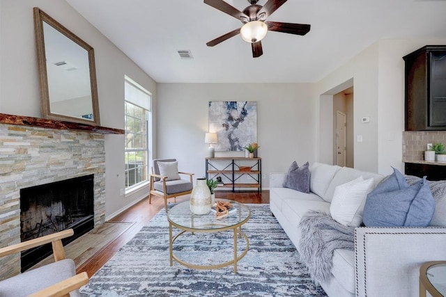 3831 Epperson Trl, Austin, TX 78732 - living room with a ceiling fan, wood finished floors, and a fireplace
