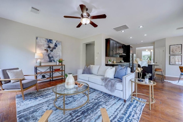 3831 Epperson Trl, Austin, TX 78732 - living room featuring a ceiling fan, wood finished floors, baseboards, and recessed lighting