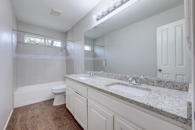 3831 Epperson Trl, Austin, TX 78732 - full bath with toilet, wood finished floors, bathtub / shower combination, and double vanity