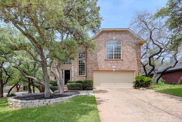 3831 Epperson Trl, Austin, TX 78732 - view of front of property with brick siding, driveway, a garage, and a front lawn