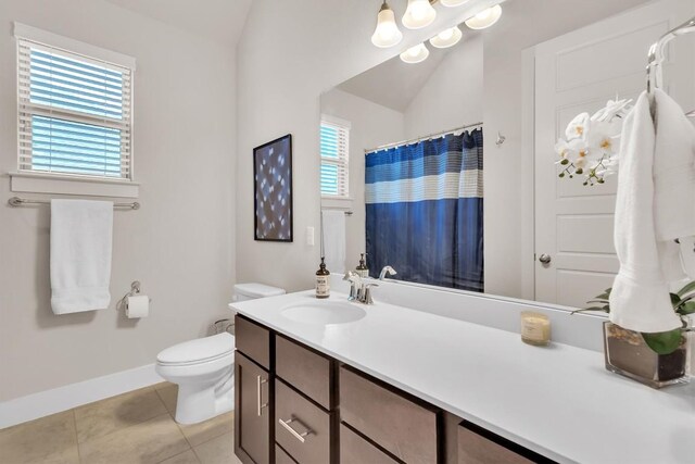 321 Millard St, Georgetown, TX 78628 - bathroom with vanity, tile patterned flooring, curtained shower, and vaulted ceiling