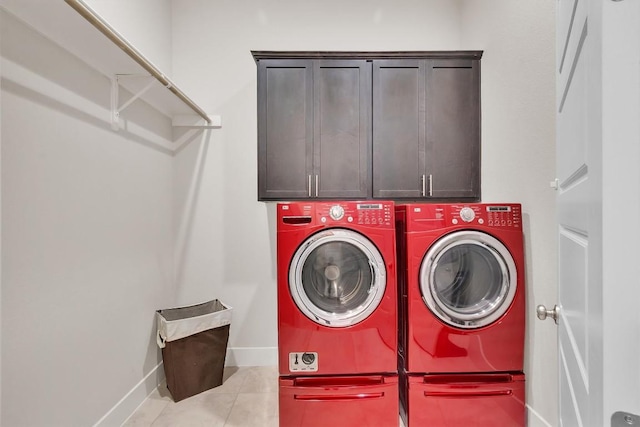 321 Millard St, Georgetown, TX 78628 - washroom with washing machine and dryer, cabinet space, and light tile patterned flooring