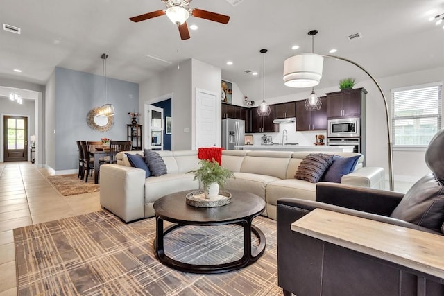 321 Millard St, Georgetown, TX 78628 - living room featuring vaulted ceiling, a ceiling fan, recessed lighting, and light tile patterned floors