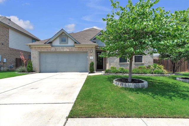 321 Millard St, Georgetown, TX 78628 - view of front of property with a garage, driveway, and a shingled roof