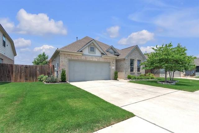 321 Millard St, Georgetown, TX 78628 - view of front of home with concrete driveway, a garage, brick siding, and roof with shingles