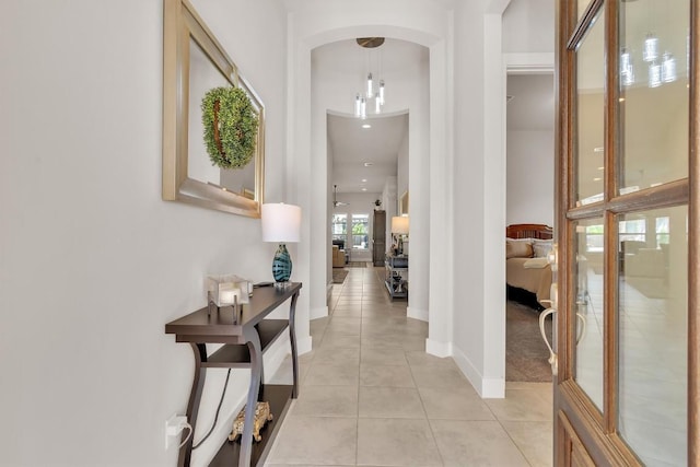 321 Millard St, Georgetown, TX 78628 - hallway featuring light tile patterned flooring and arched walkways